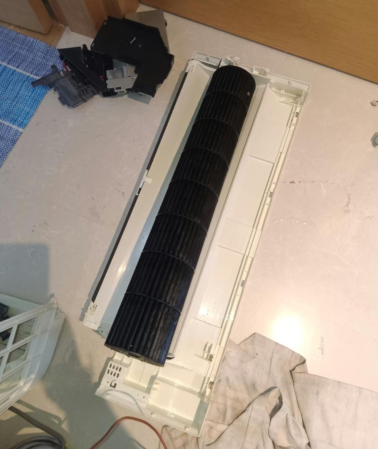 Aircon blower fan and housing removed for cleaning