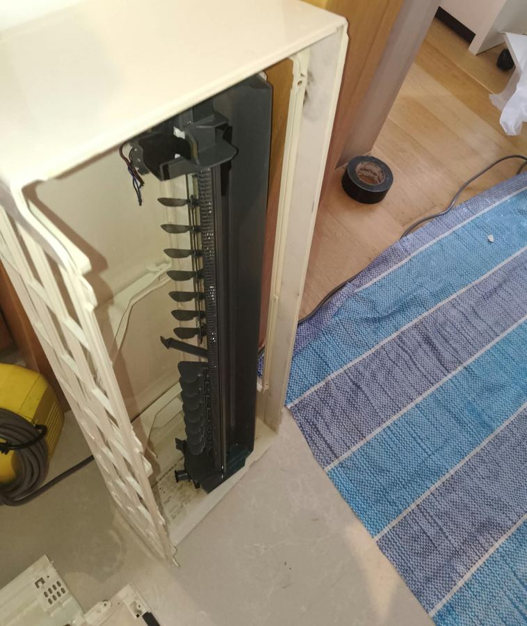 Aircon casing opened with floor protection laid down