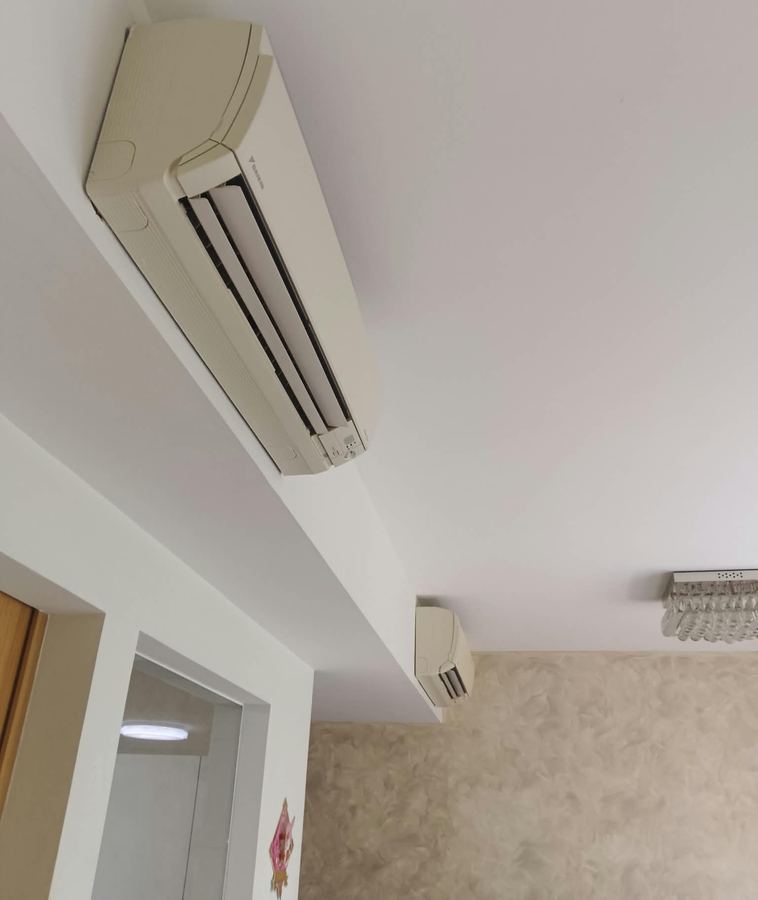 Wall-mounted aircon unit after servicing in a home